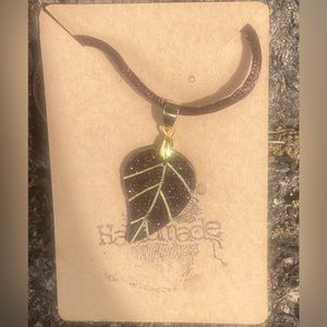 Brown and gold necklace pendant